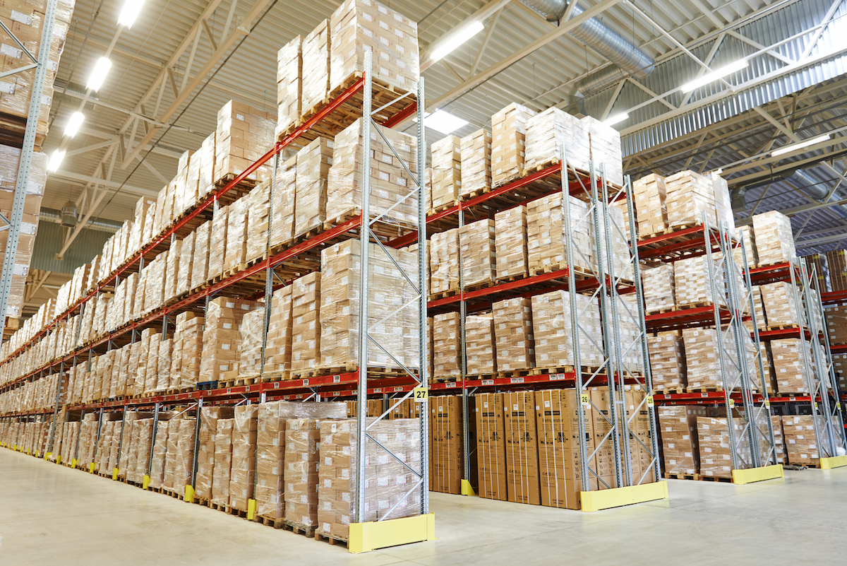 interior of modern warehouse. Rows of shelves with boxes :